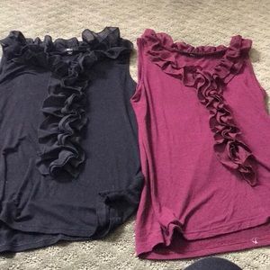 2 ruffled sleeveless shirts